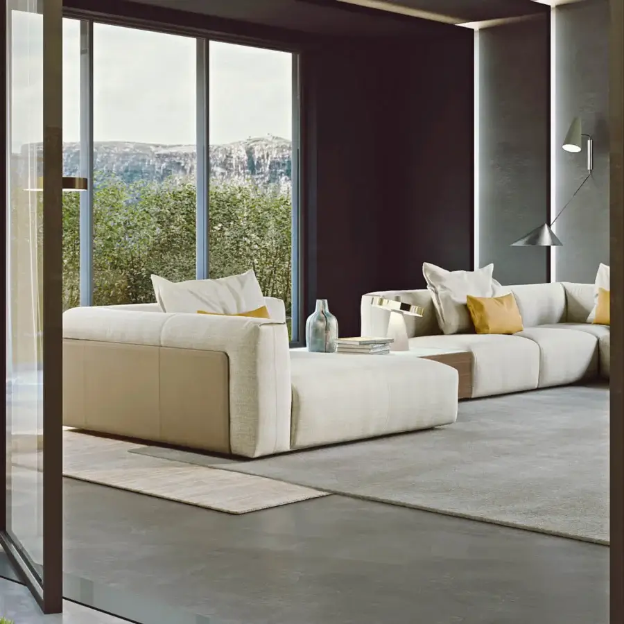 Distinguished Turri Soul sectional with light beige textile upholstery and leather inserts exhibiting a contemporary low profile design