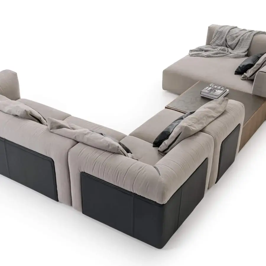 Handcrafted Turri Soul sectional with light beige textured textile, precious leather details and dark wood with stone-like side table