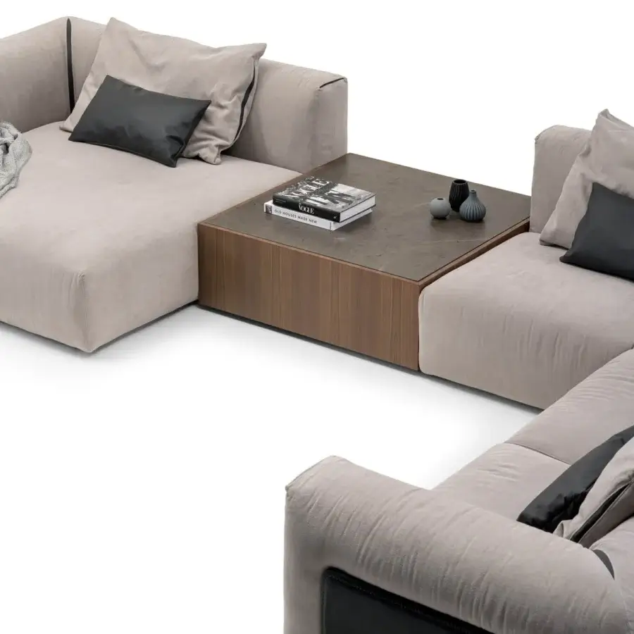Lavish Turri Soul sectional with light beige textile upholstery, dark wood-like table and precious leather inserts