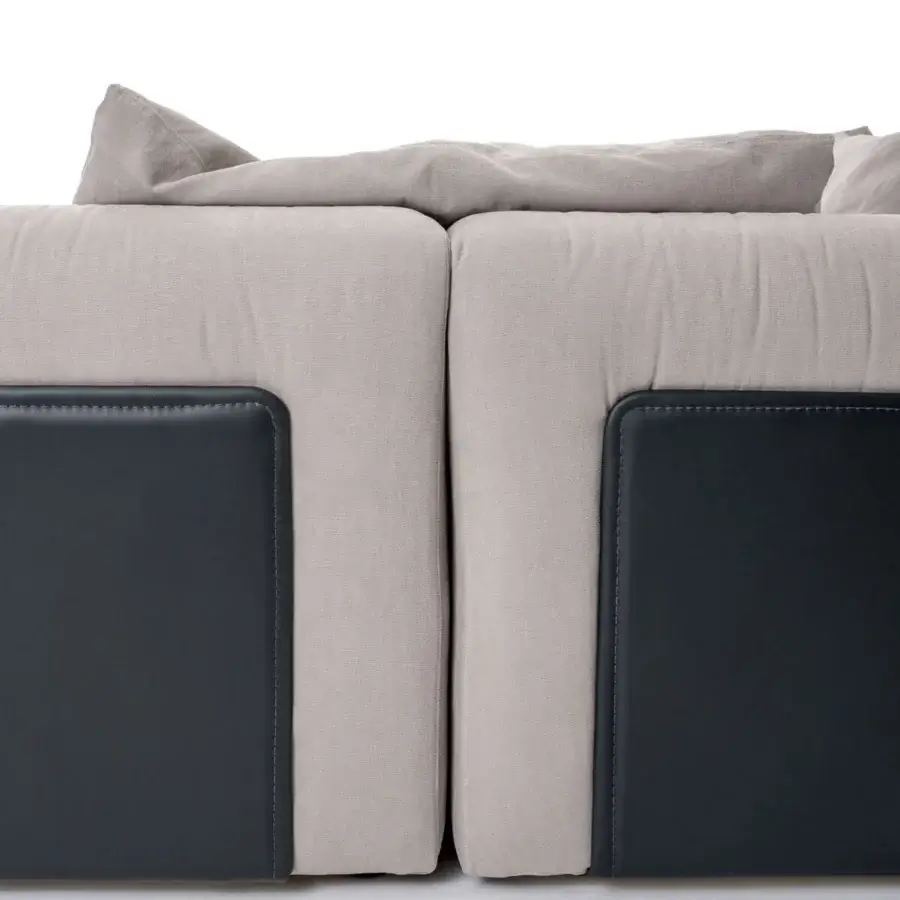 Distinguished Turri Soul sectional with light gray textile and dark contrasting border in a matte finish