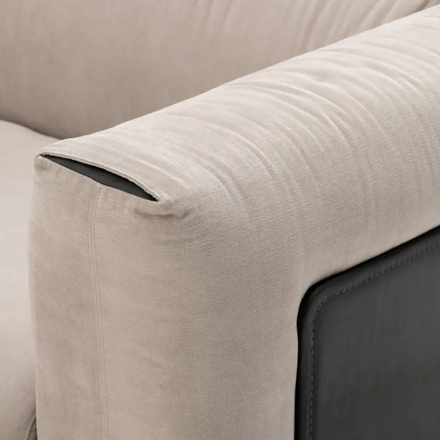 Superior Turri Soul sectional upholstered in light beige textile with matte finish and darker leather accents