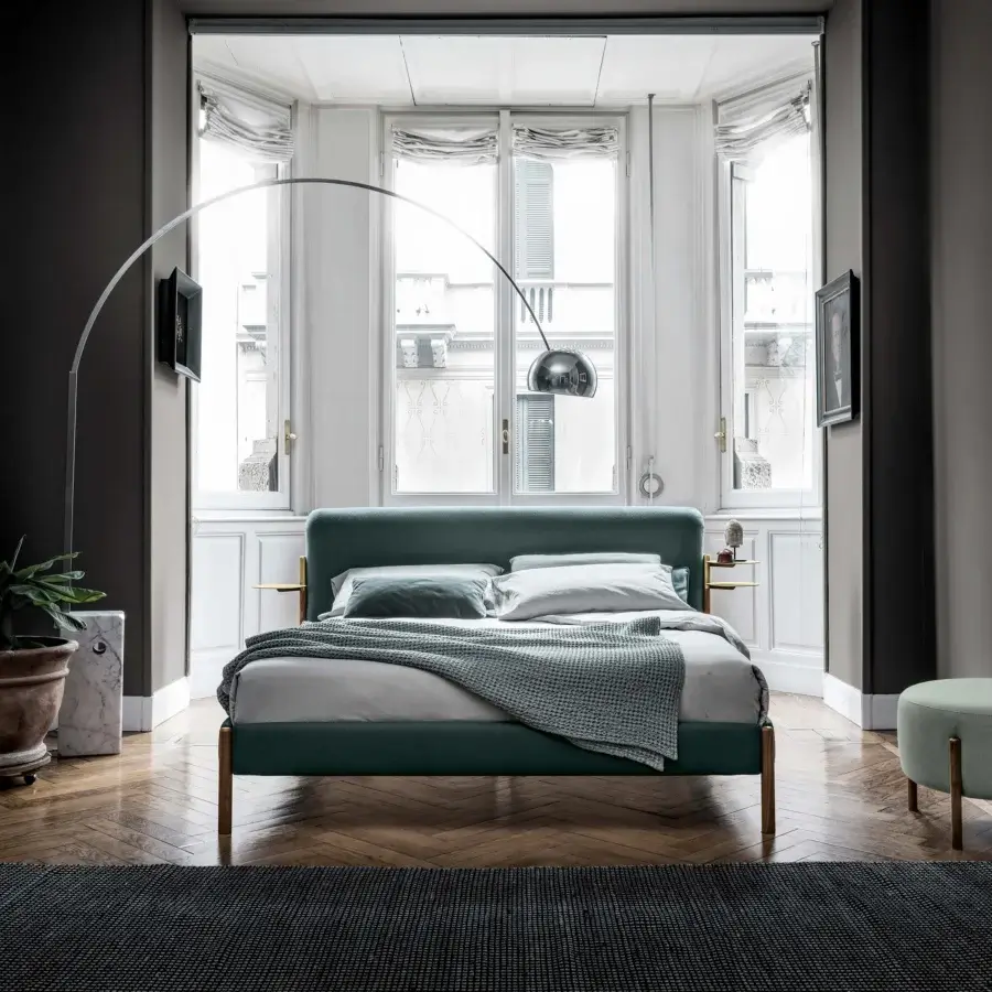 Distinguished Bolzan Letti Flag bed with muted teal textile and sleek wooden legs crafted with brass accents