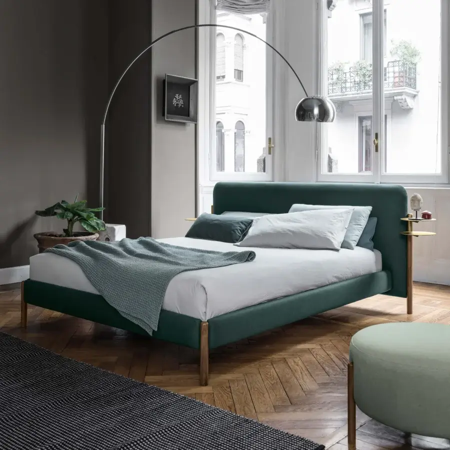 Stylish Bolzan Letti Flag bed with green textile upholstery, light-brown wood legs and integrated golden-brass side tables