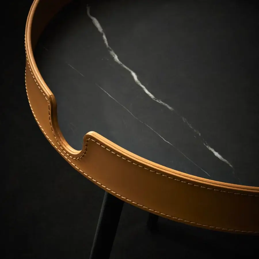 Distinguished Bolzan Letti Gabri side table with swirling neolith top and hand-crafted light brown leather trim