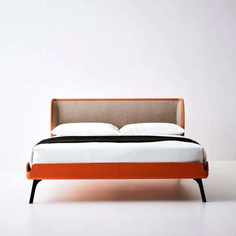 Distinguished Bolzan Letti Gabri bed with vibrant orange leather upholstery and textured woven textile headboard crafted with black tapered legs