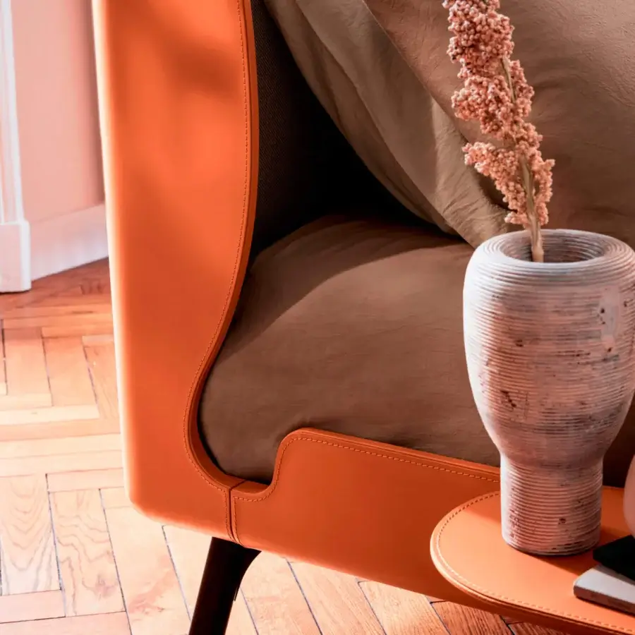 Exceptional Bolzan Letti Gabri bed with enveloping orange leather headboard and dark wooden legs
