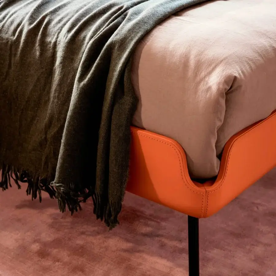 Lavish Bolzan Letti Gabri bed with enveloping orange leather upholstery and skilled stitching detail