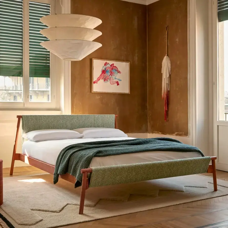 Distinguished Bolzan Letti Jack bed crafted with metal and warm brown wood, showcasing a decorative green and off-white textile covering