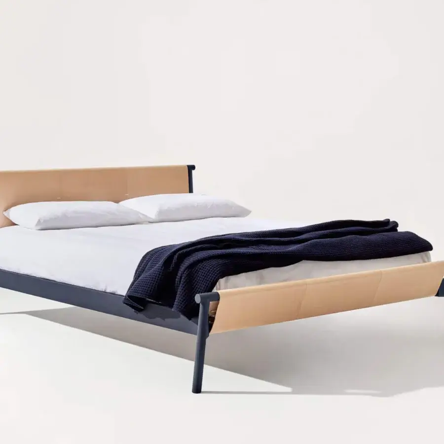 Elegant Bolzan Letti Jack bed with essential metal frame and tan leather-like panel accents offering a minimalist aesthetic