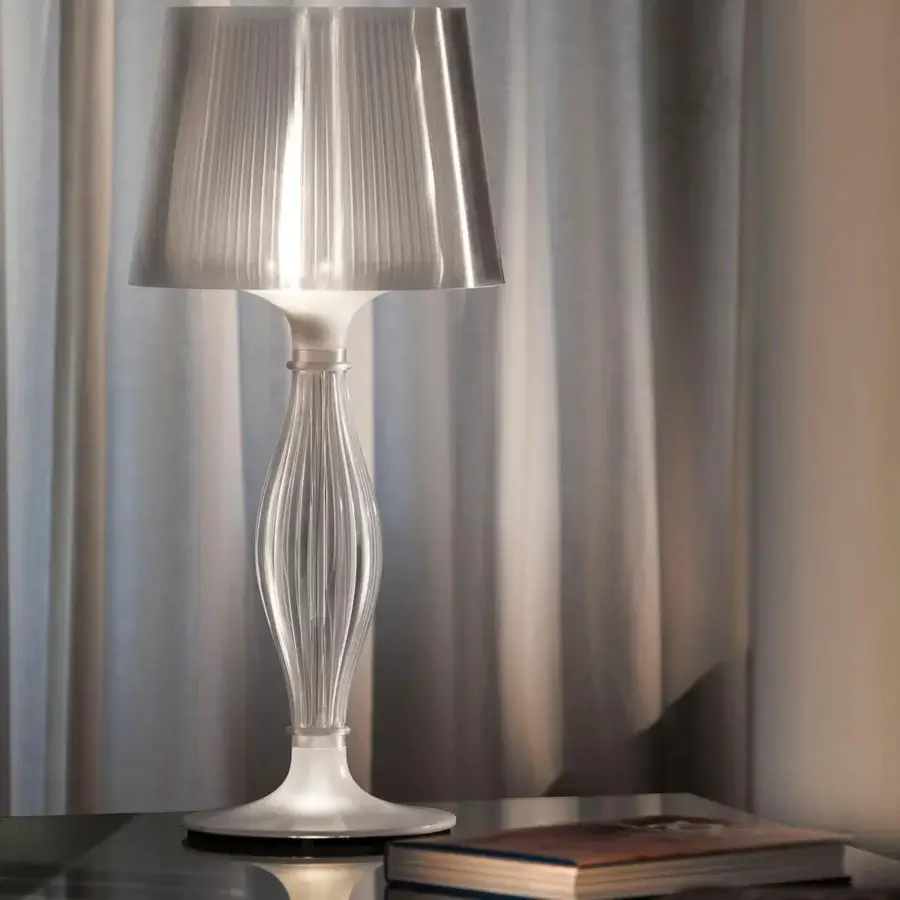 Distinguished Slamp Liza table lamp in techno-polymer with a pleated shade and ribbed body exhibiting double illumination