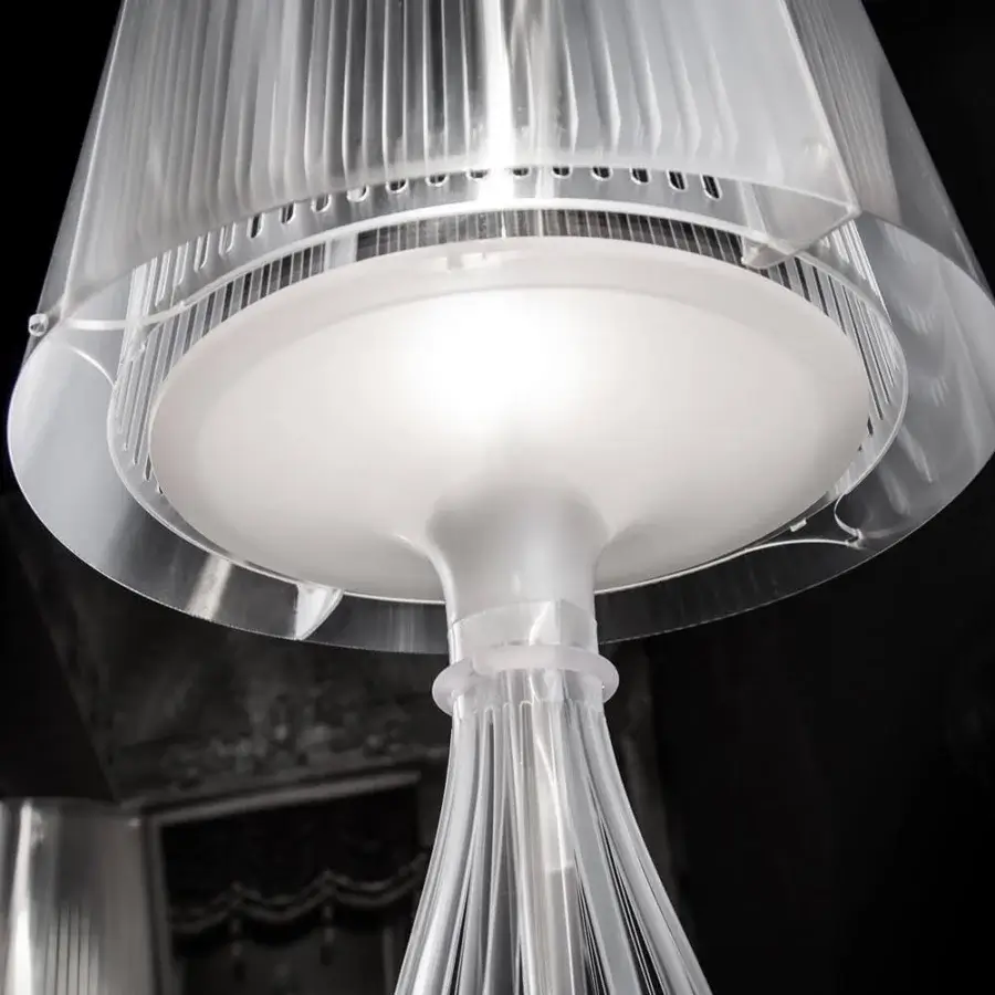 Elegant Slamp Liza table lamp crafted in frosted white techno-polymer with a pleated conical shade and stylized vase base