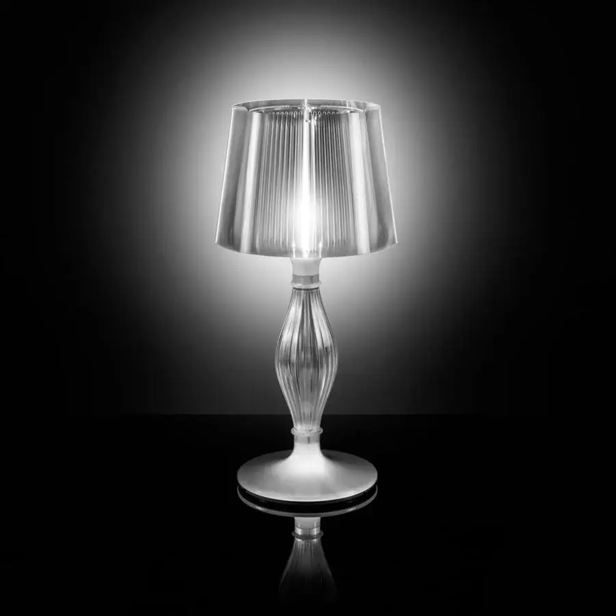 Exceptional Slamp Liza table lamp with baroque inspiration crafted in transparent techno-polymer with reflective base