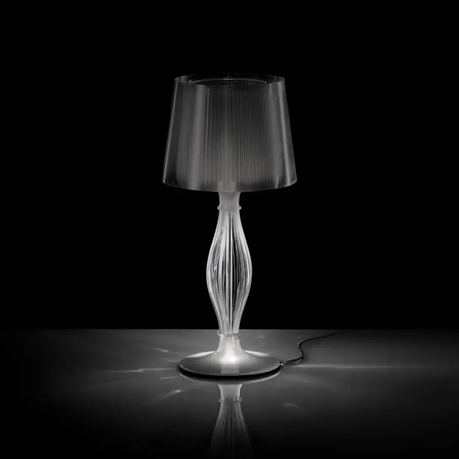 Superior Slamp Liza table lamp with pleated lampshade and curved stem crafted in translucent techno-polymer with glossy finish