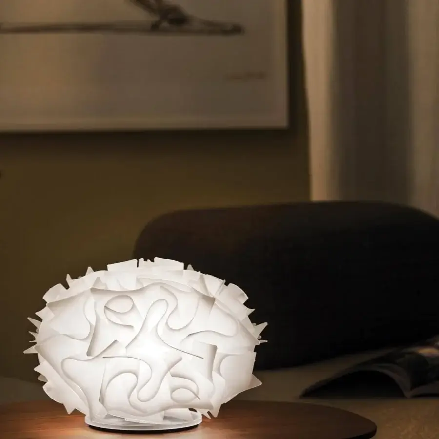 Exceptional Slamp Veli table lamp crafted in embossed Opalflex® with overlapping white elements emitting warm diffused light