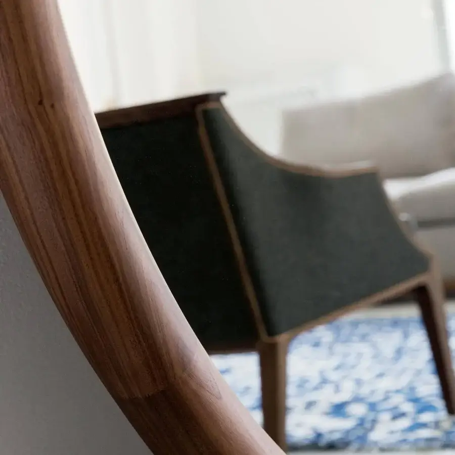 Superior Porada Giove mirror with tall narrow frame in solid Canaletto walnut exhibiting warm brown wood grain