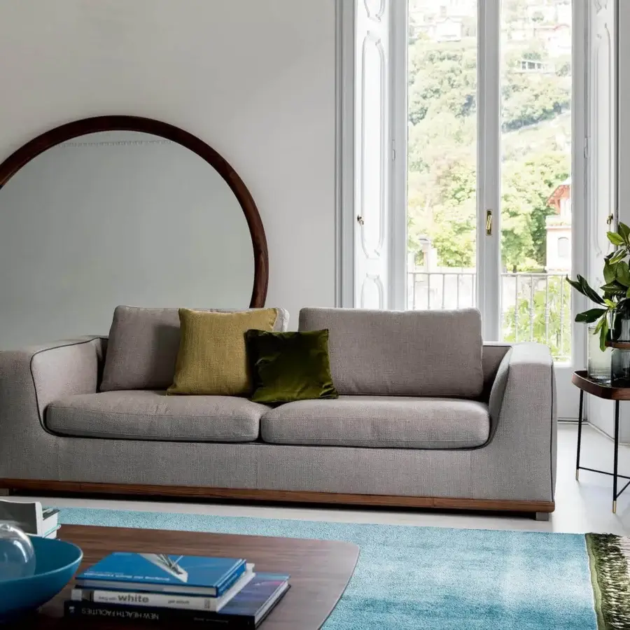 Exceptional Porada Giove mirror with large circular reflective surface in solid Canaletto walnut and dark brown finish