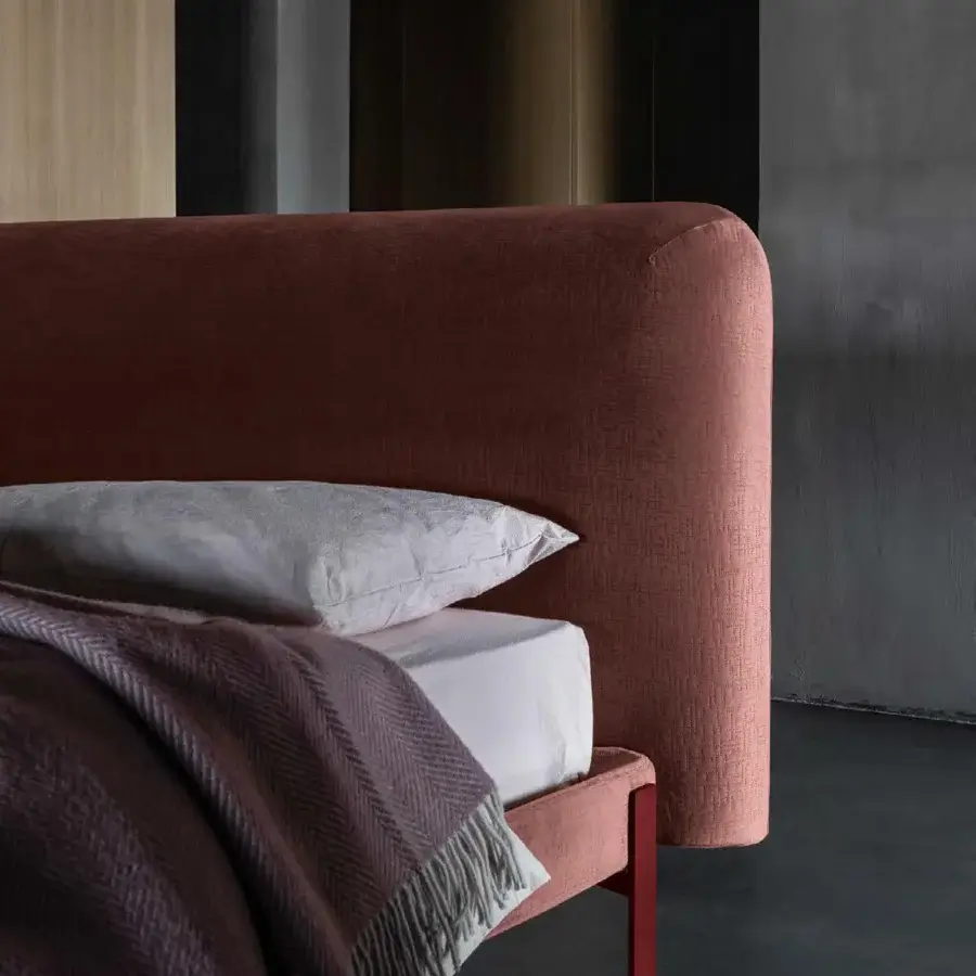 Exclusive Bolzan Letti Joy bed with reddish-brown textile and geometric metallic legs, crafted in Italy with a firwood structure