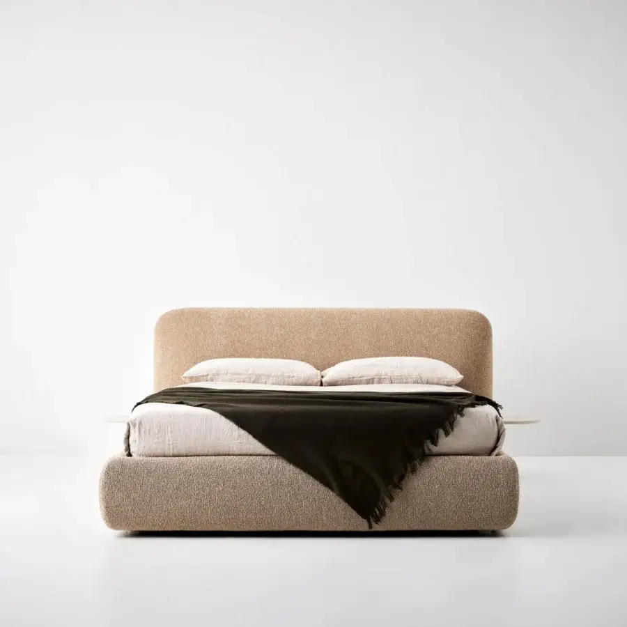 Sophisticated Bolzan Letti Marty bed with light tan textured textile upholstery and integrated side tray
