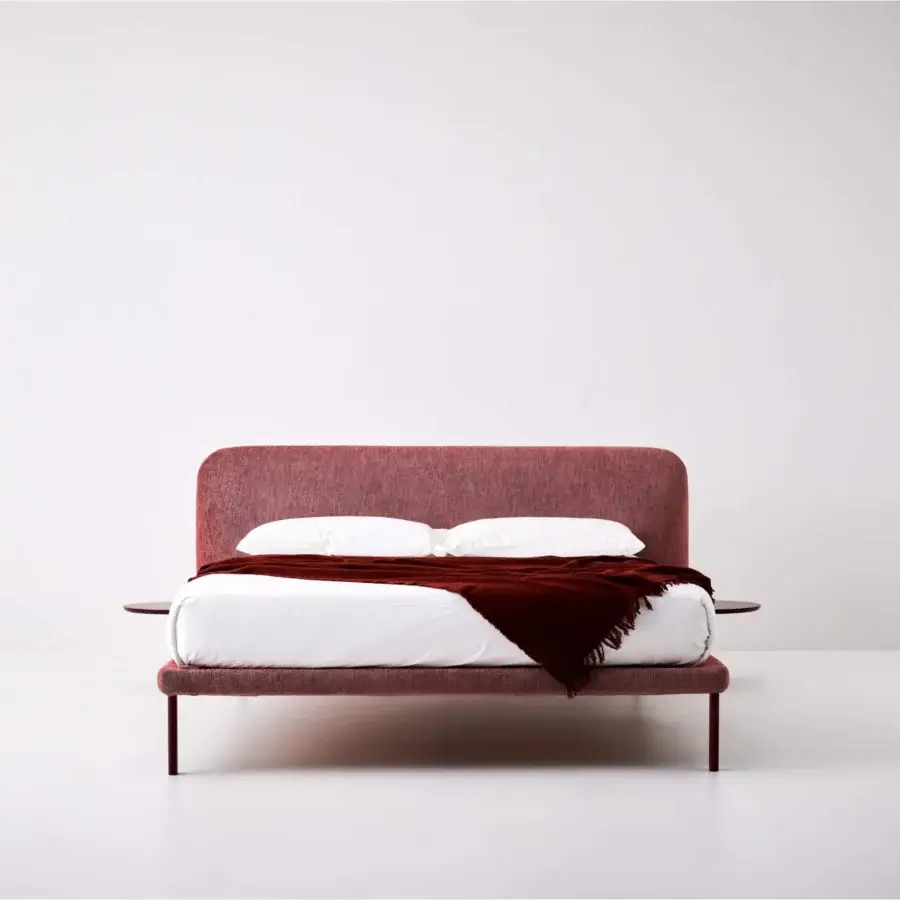 Exceptional Bolzan Letti Marty bed with a sofa-like padded headboard and side trays in textured reddish-pink textile upholstery