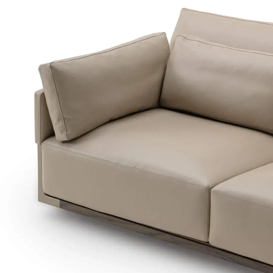 Distinguished Turri Drum sofa with walnut wood structure, metal details, and light beige Italian leather cushions offering a uniform finish