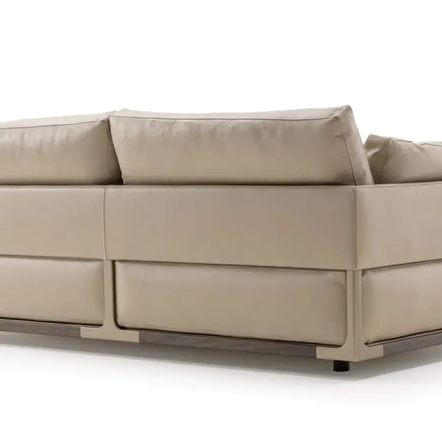 Lavish Turri Drum sofa with walnut wood structure, metal details, and light beige upholstery