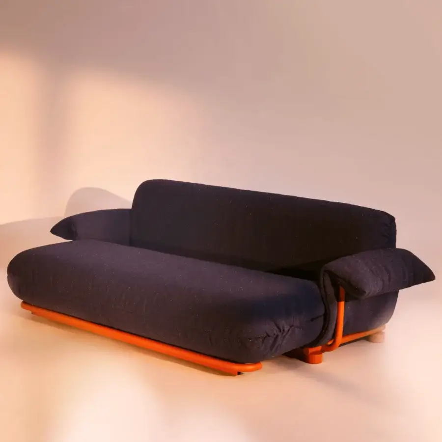 Lavish Bolzan Letti Mate sofabed with dark blue speckled textile upholstery and bright orange metal frame