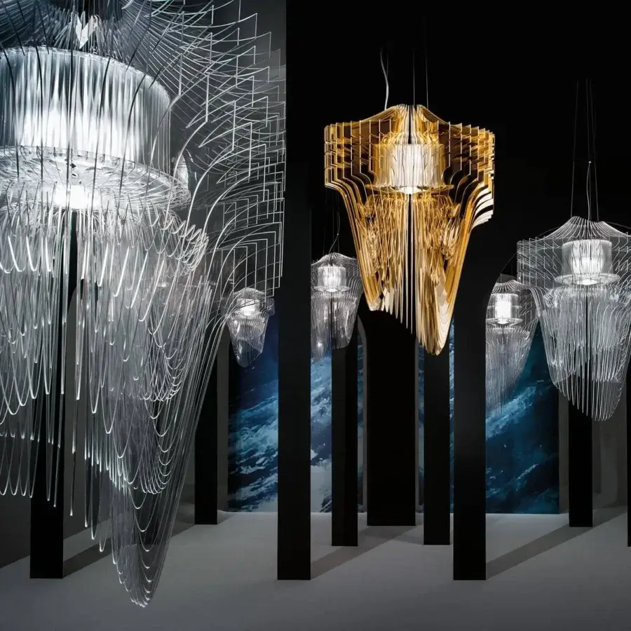Lavish Slamp Aria suspension lamp crafted from Cristalflex® with lustrous gold powder finish and curved lines
