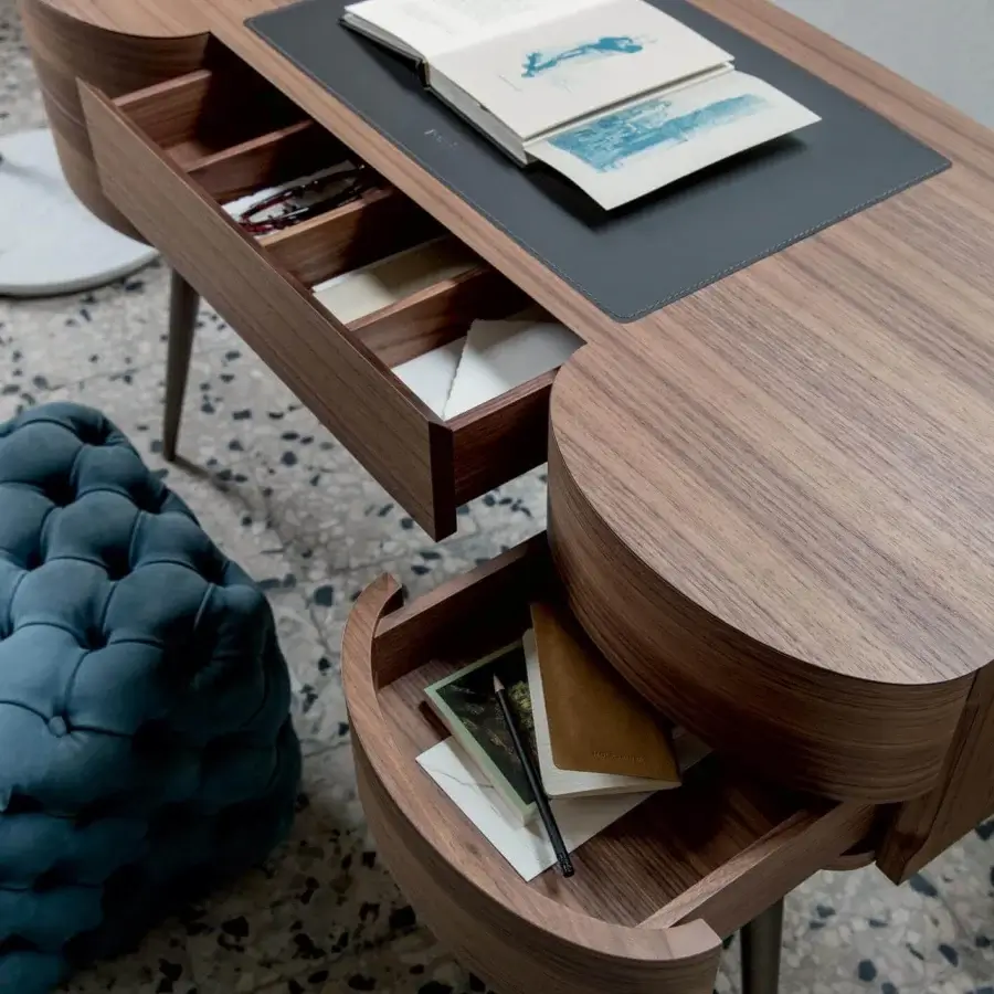 Distinguished Porada Micol desk crafted in Italy with canaletta walnut, bronzed brass legs and dark Cuoietto leather detailing with a smooth finish