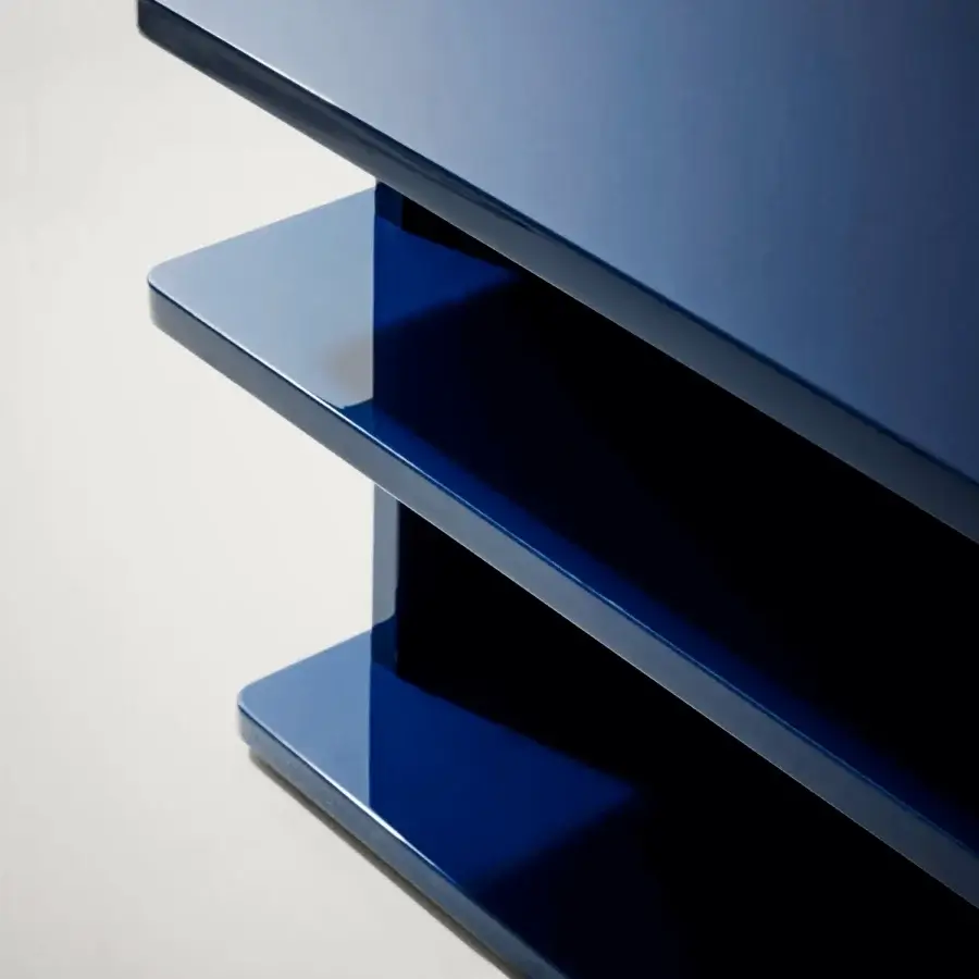Exceptional Bolzan Letti Dominic side table crafted in deep blue lacquered HDF with stacked rectangular tiers and high-gloss finish
