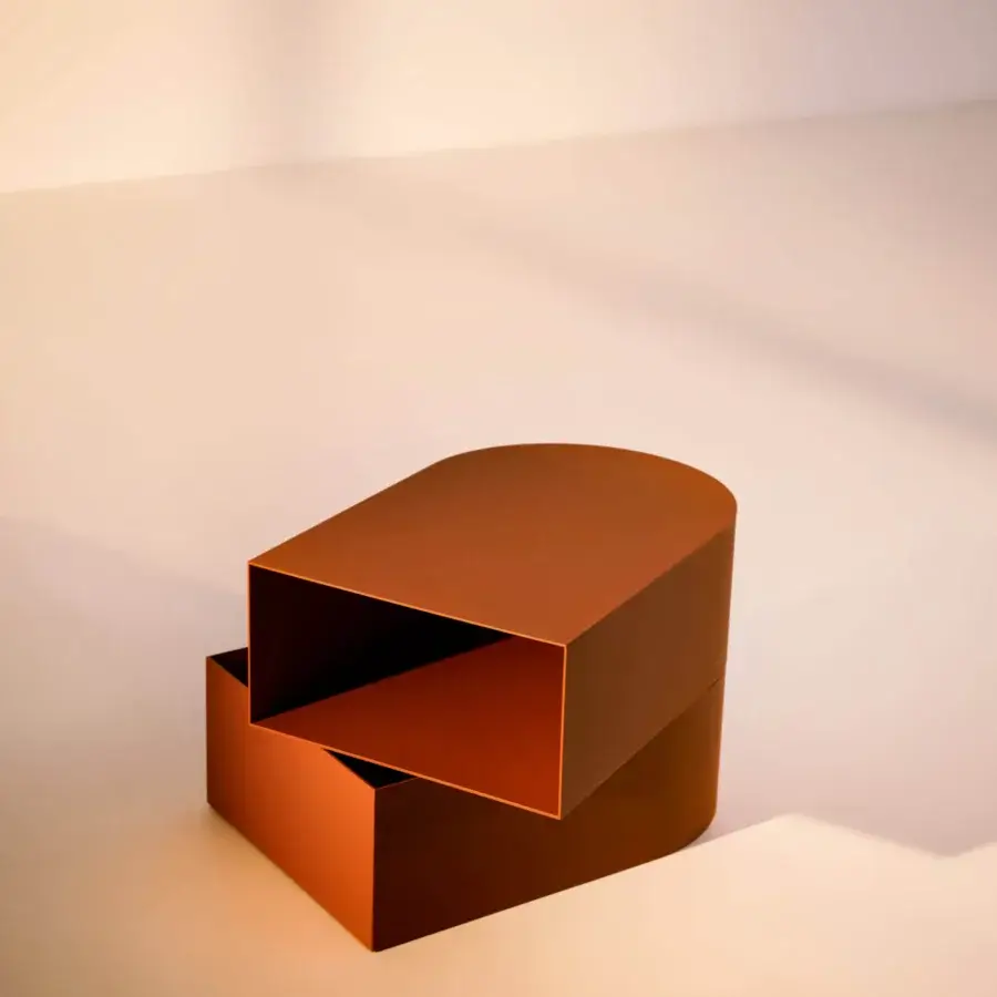 Distinguished Bolzan Letti Abside nightstand with intersecting volumes in warm orange metal and matte lacquered finish