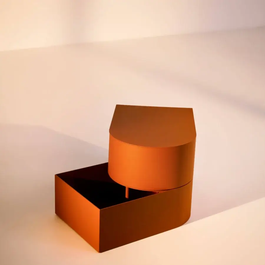 Distinguished Bolzan Letti Abside night table in orange-brown metal with a matte lacquered finish reveals a rotating cylindrical top