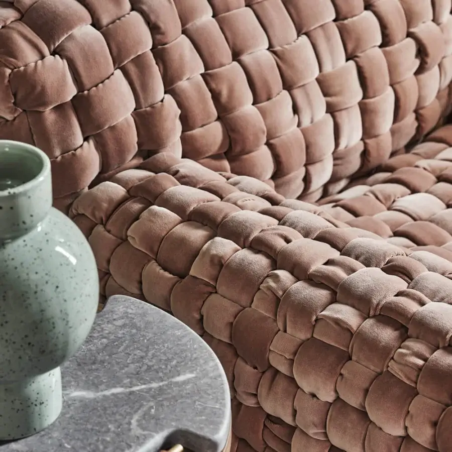 Sumptuous Turri Azul lounge chair with dusty rose velvet and uniform woven texture evoking hand-crafted artistry