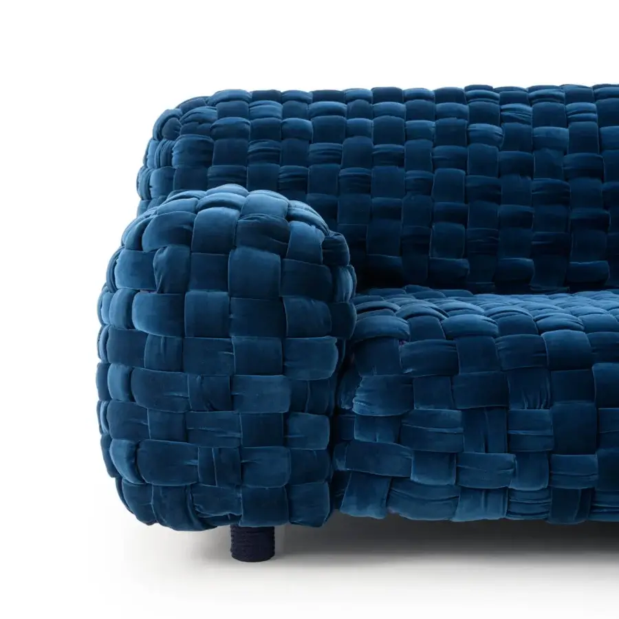 Distinguished Turri Azul sofa presents a meticulous macro weave in deep blue velvet with a rounded form