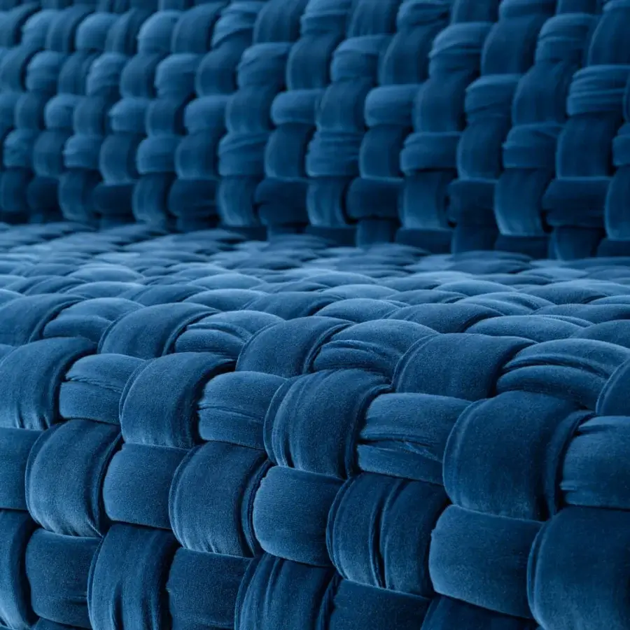 Captivating Turri Azul sofa presents a meticulous macro weave in lavish deep blue velvet creating a welcoming aesthetic