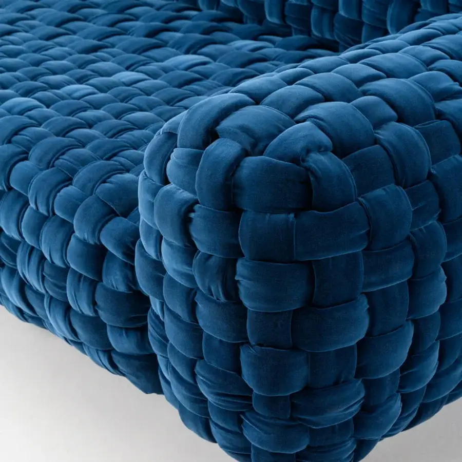 Distinguished Turri Azul sofa presents a handcrafted macro weave in sumptuous deep blue velvet with a rounded silhouette