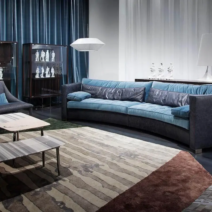 Distinguished Erba Alchimia sectional upholstered in muted blue textile with solid wood frame and sleek metal legs