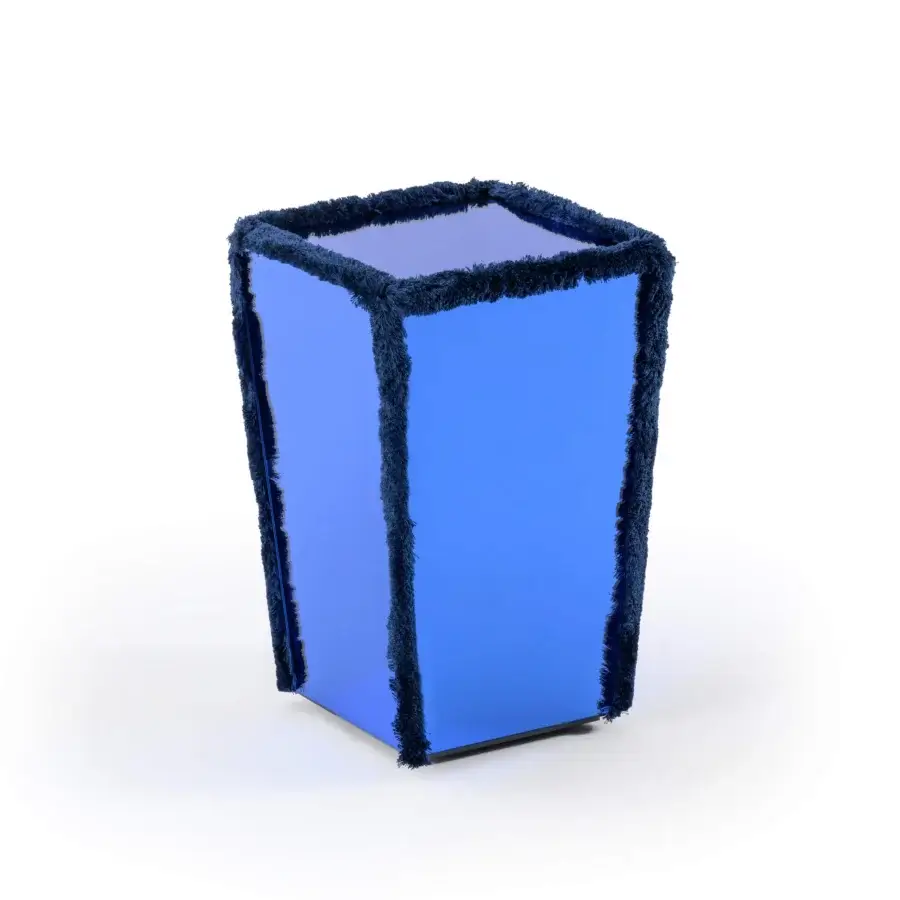 Elegant Turri Azul side table with geometric form and glossy blue finish highlighted by playful fringe piping