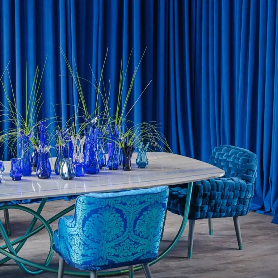 Distinctive Turri Azul armchair with woven turquoise velvet upholstery and glossy light gray lacquered wooden legs