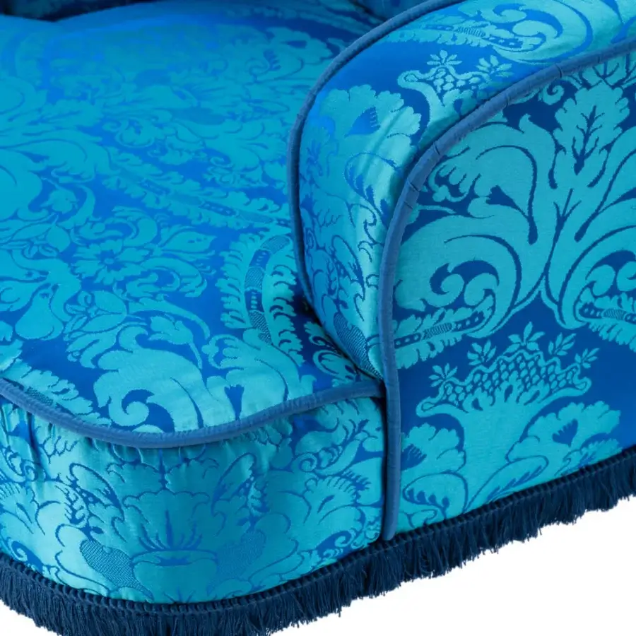 Distinguished Turri Azul armchair in vibrant blue patterned fabric with fringe, built with glossy lacquered polyester wooden legs