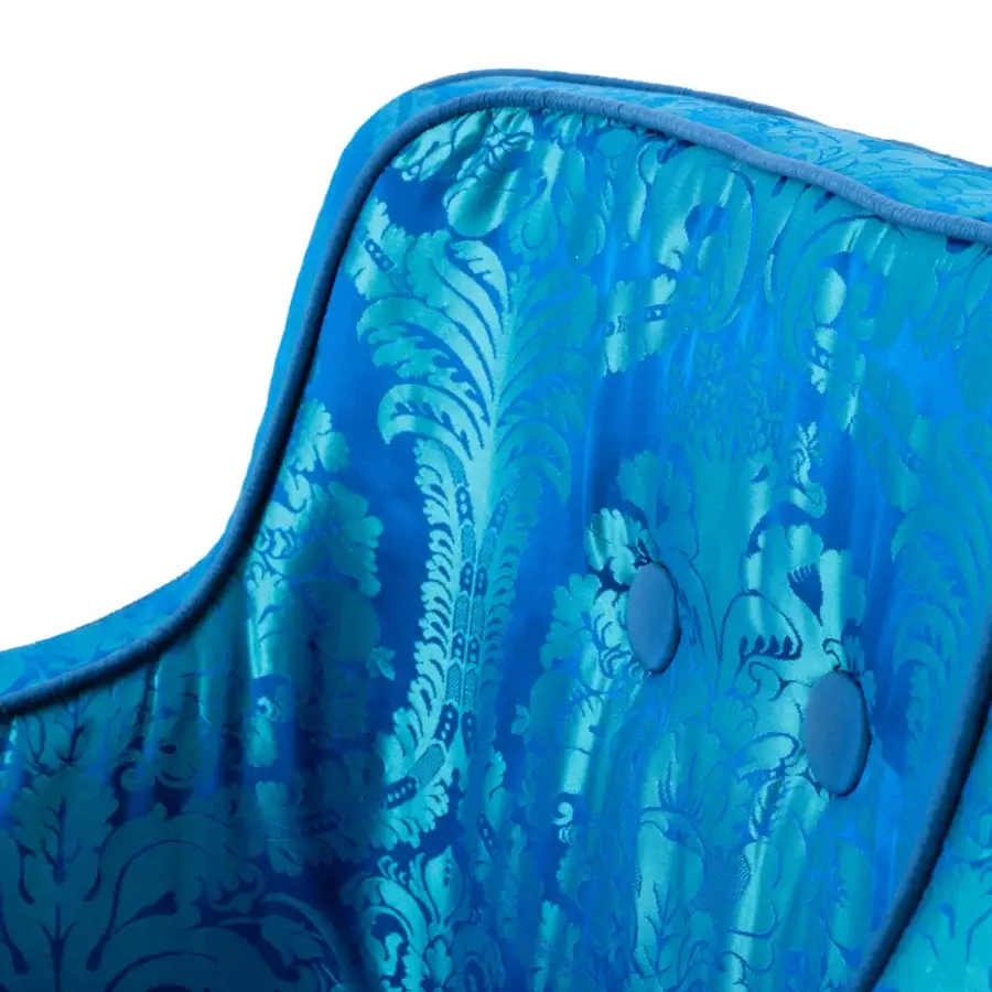 Captivating Turri Azul armchair in vibrant blue textured textile with fringe, built upon glossy lacquered wooden legs