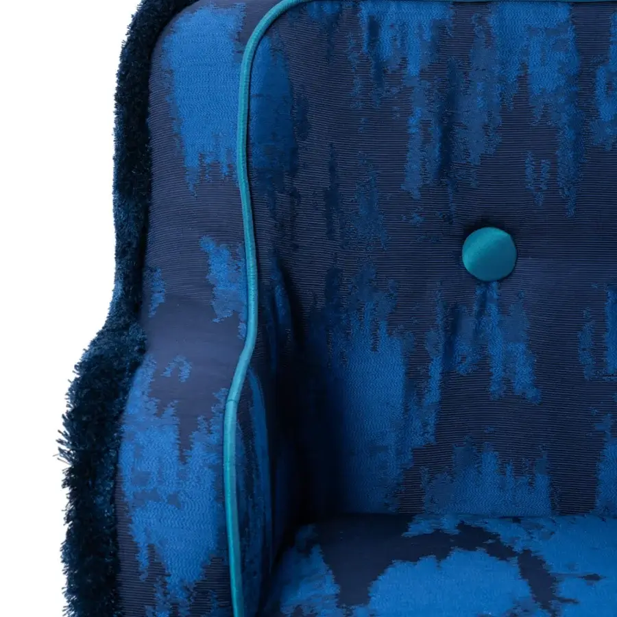 Lavish Turri Azul armchair in patterned textile with blue fringe and glossy lacquered wooden legs