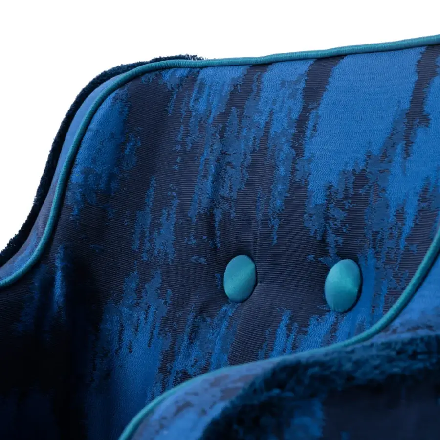Superior Turri Azul armchair in deep blue textured fabric with light teal piping and glossy lacquered wooden legs