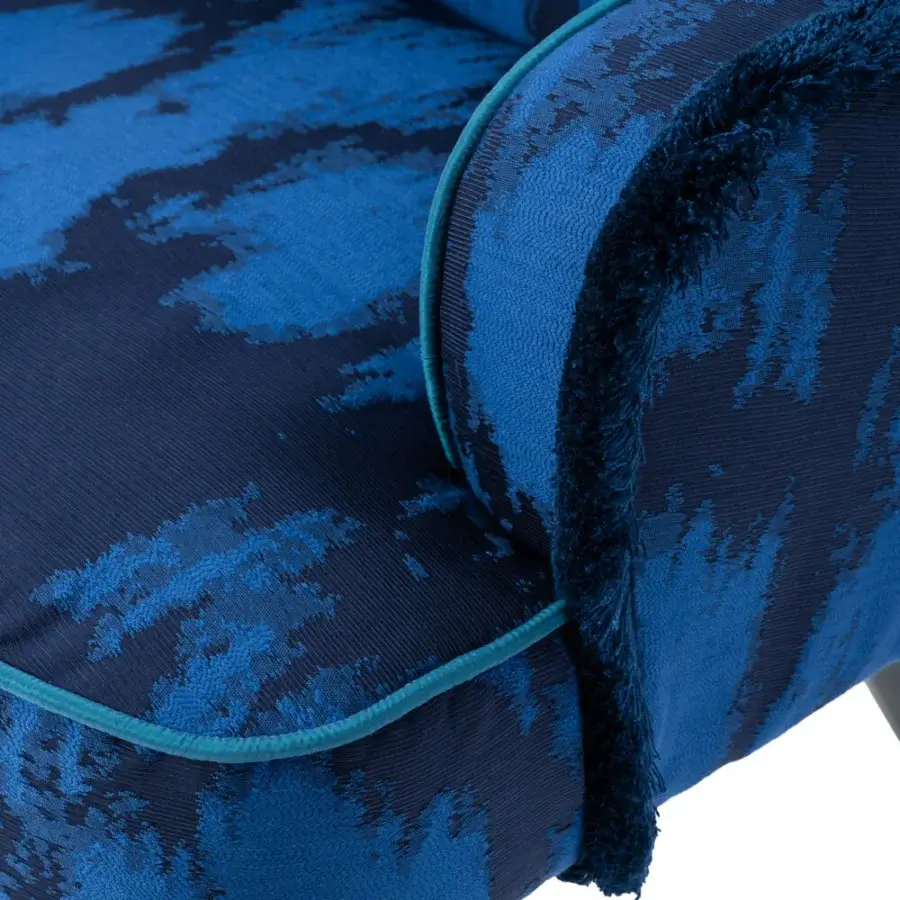 Distinguished Turri Azul armchair in patterned blue textile with lighter blue piping and glossy lacquered polyester wooden legs