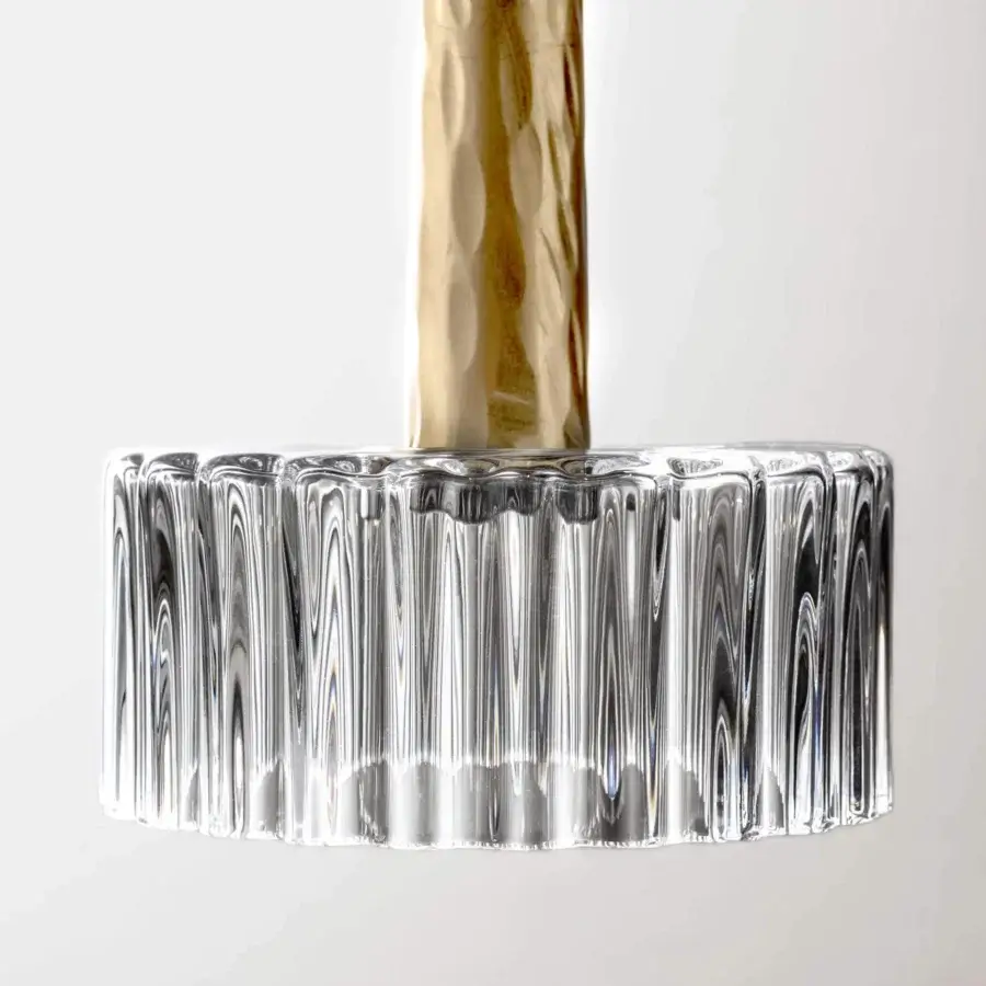 Elegant Stillux Median suspension lamp with clear fluted crystal and textured hammered metal in bronze or gold tone
