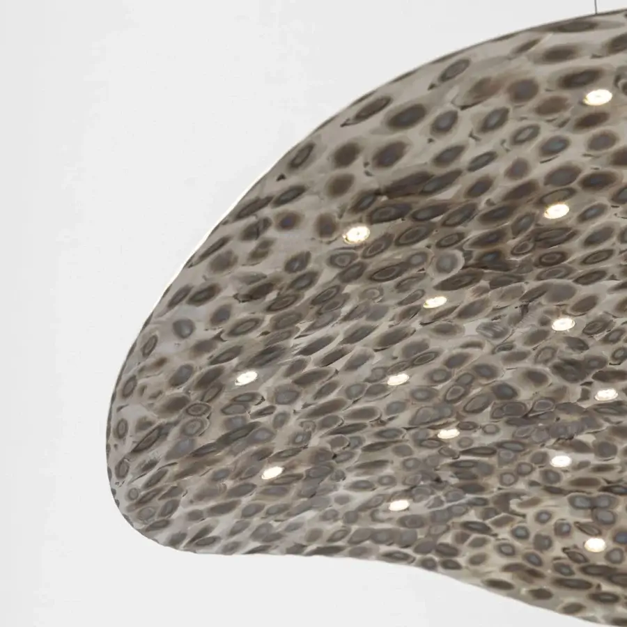 Distinguished Stillux Flat suspension lamp crafted in grayish-beige hammered metal with unique mottled oval shapes and embedded lights