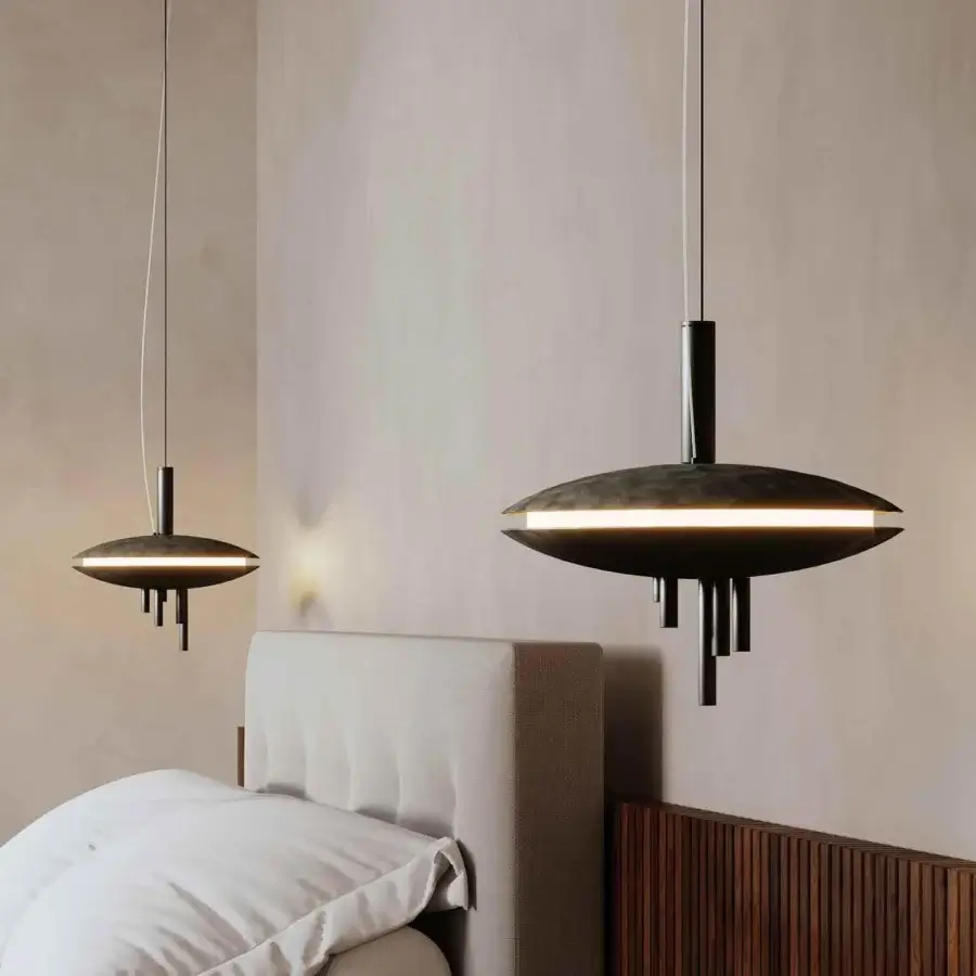 Innovative Stillux Orbital suspension lamp with hammered metal structure and flattened disc form emitting uniform white light