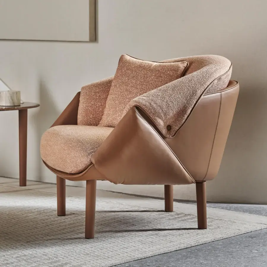 Exceptional Turri Riban lounge chair crafted in light-brown speckled fabric and smooth tan leather with cylindrical wooden legs