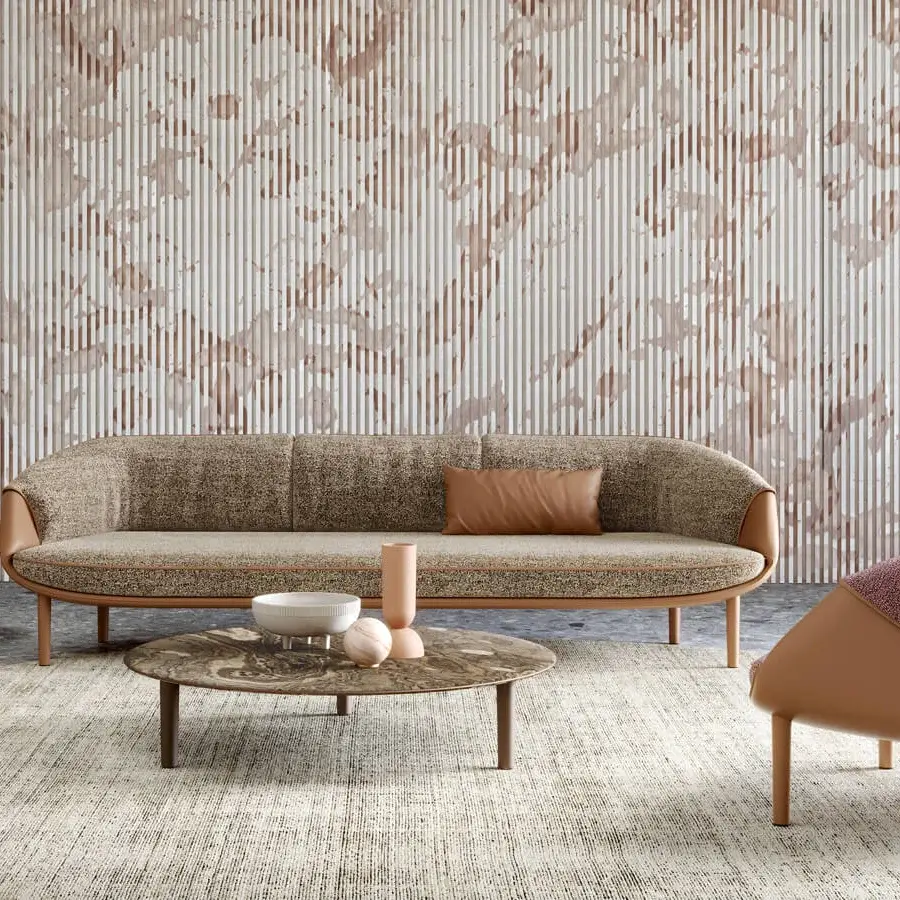 Superior Turri Riban lounge chair crafted in light brown leather-like material with reddish patterned textile upholstery