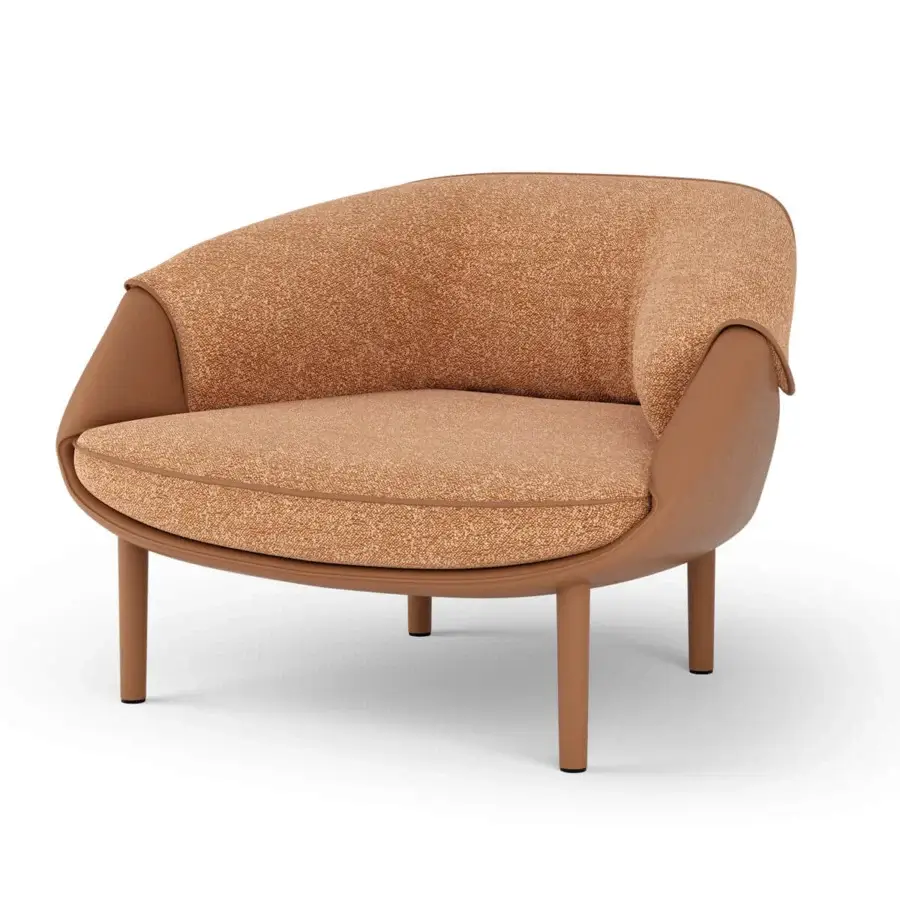 Superior Turri Riban lounge chair with speckled orange and beige textile upholstery and smooth light brown leather panels