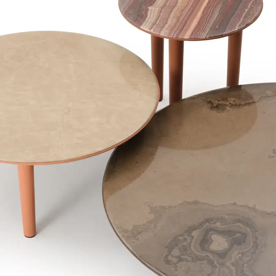 Distinguished Turri Riban coffee table with organic form, beige marble top and orange leather-covered legs crafted in Italy